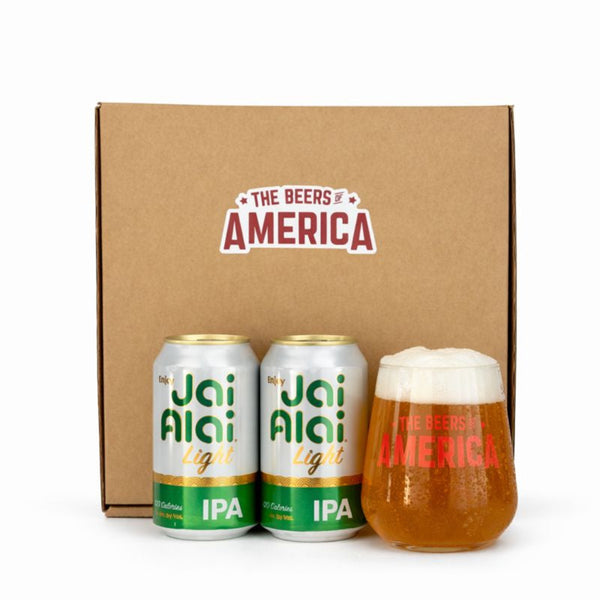 Two cans of Jai Alai Light IPA and a glass of beer in front of 'The Beers of America' branded box.
